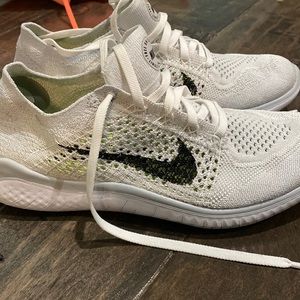 Grey and black Nike fly knits